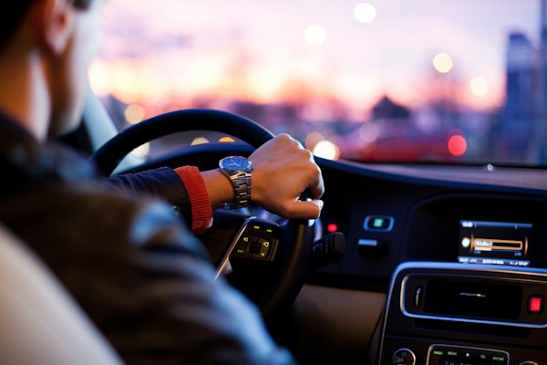 Driver on the road with auto insurance protection
